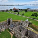 A view of the castle grounds from the top of the castle. Across the water you can see Portsmouth and Spinnaker Tower