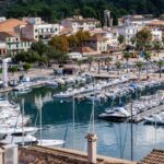 The harbour in Soller with a lot of yachts and small boats anchored in the bay