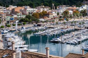 The harbour in Soller with a lot of yachts and small boats anchored in the bay