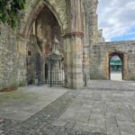 The Titanic memorial fountain, behind a gate, in the left hand side of the ruined church.