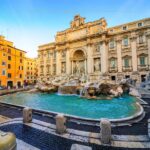 A photo of Trevi fountain in Rome at sunrise, without any people around it.