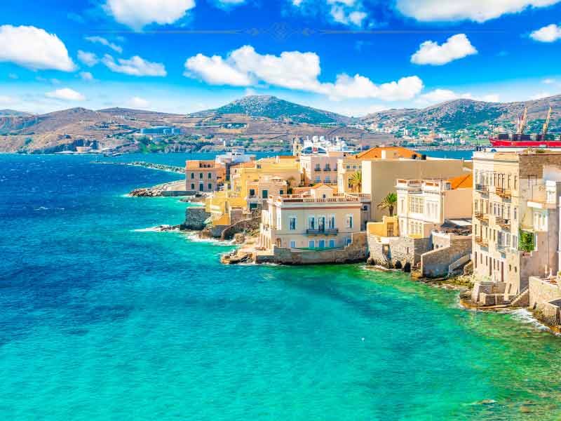 A city built on the edge of the water, which has a beautiful azure colour.