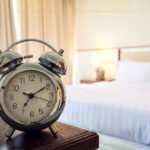 An alarm clock inside a hotel room