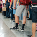 People waiting in line to board a plane