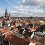 An aerial view of Utrecht, in which you can see the rooftops of the old town as well as the Dom tower