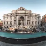 A photo of Fontana di Trevi at sunrise, without any people around.