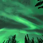 A green sky lit by the northern lights.