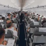 A photo of a plane full with people