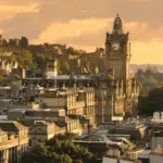 The city of Edinburgh at sunset, with the light reflecting gold into the medieval buildings