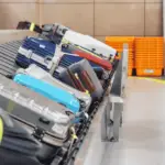 Luggage on a carousel, at the airport.