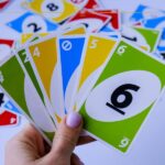 Things to Pack to Keep You Entertained on Your Next Trip A hand of cards of Uno