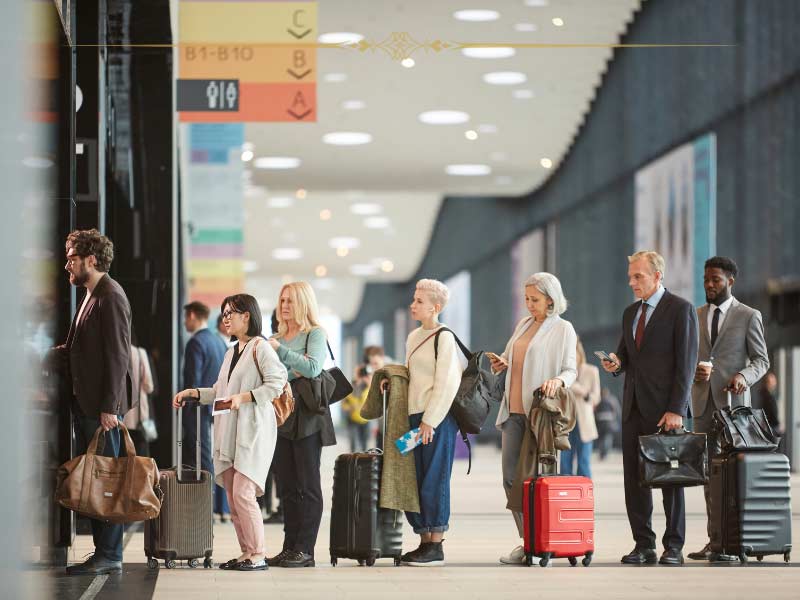 A group of people at the airport waiting to board a plane