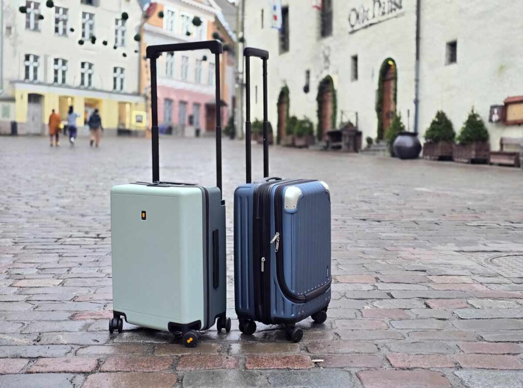 The suitcases next to each other, on a cobbled street