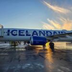 My Icelandair Review – Flying From London Gatwick to Reykjavik and Back An Icelandair plane with the sunset behind it at Keflavik airport