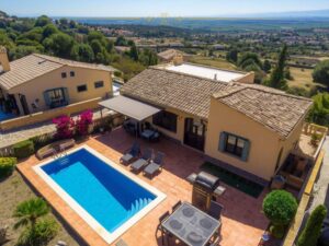 An aerial view of a holiday home with a pool